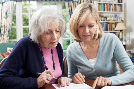 Woman Helping her Elderly Mother