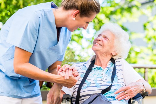 Nurse Helping Elderly Woman