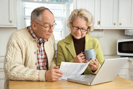 Elderly man and woman reading