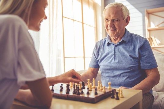 Elderly man playing chess