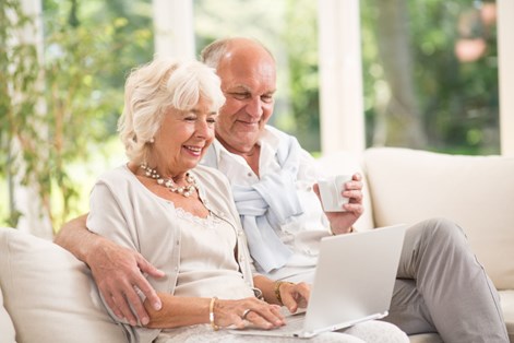 Elderly couple using a computer