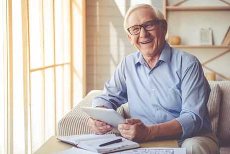 Elderly man using technology