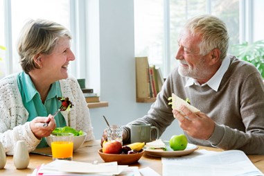 Elderly couple eating