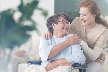 Elderly woman with nurse