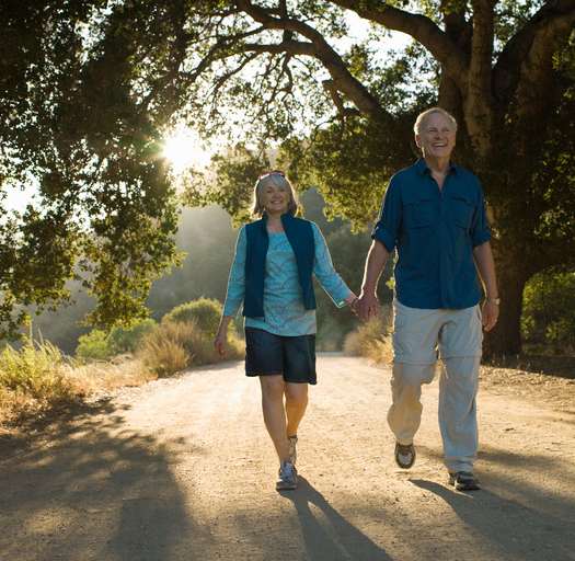 Senior couple walking at Christian Care Senior Living community in Cottonwood