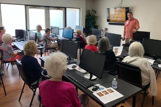 Photos of seniors in computer class at Fellowship Square
