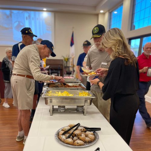 Picture of residents enjoying Veteran's breakfast at Fellowship Square Surprise