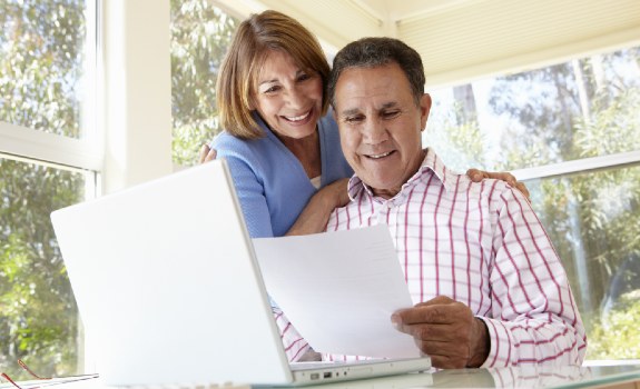 Photo of senior couple learning about Fellowship Square Senior Living in Surprise