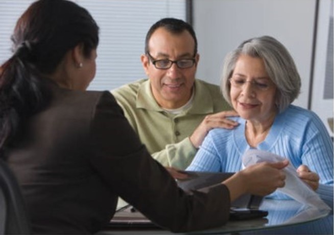 Senior couple meeting with an advisor at Fellowship Square Historic Mesa.