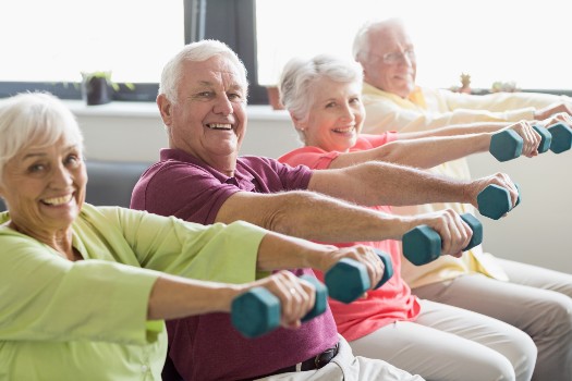 Seniors in group exercise class at Fellowship Square Surprise