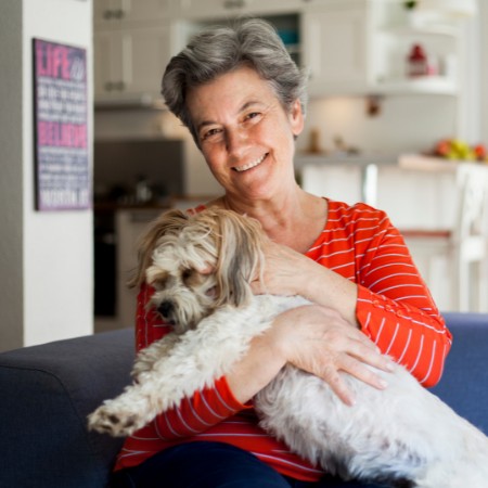 Woman with her dog at Fellowship Square Independent Living Tucson