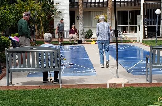 Photo of seniors playing shuffleboard at Fellowship Square Independent Living in Tucson