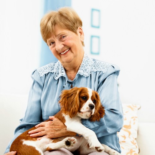 Photo of senior with her dog at Fellowship Square retirement community in Tucson