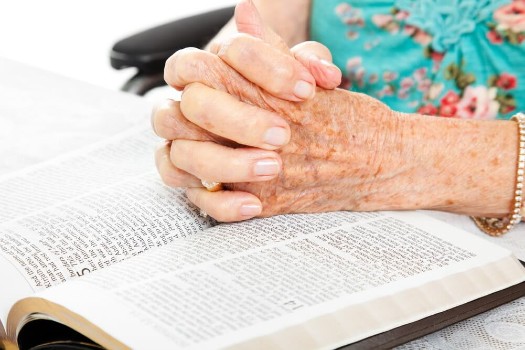 A photo of a senior woman in Bible study at Fellowship Square Phoenix