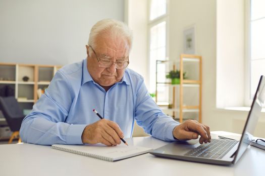 Senior man calculating costs for Independent Living in Phoenix