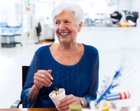 Photo of woman enjoying the cafe with friends at Fellowship Square retirement communities in AZ